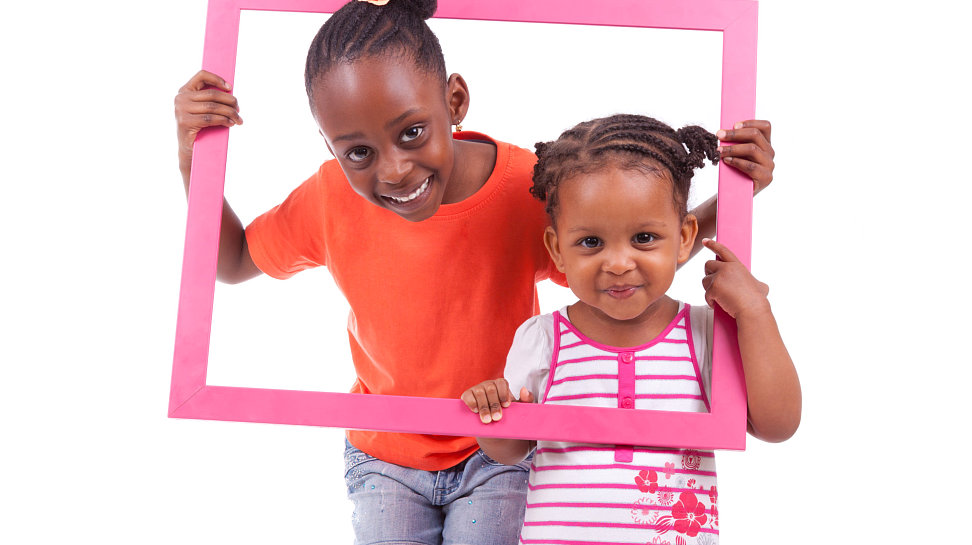 two child in a pink portrait 